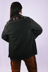 long sleeve women's vintage 1970's button up blouse with collar and pockets in chocolate brown has embroidered flowers
