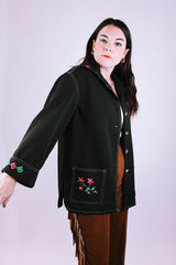 long sleeve women's vintage 1970's button up blouse with collar and pockets in chocolate brown has embroidered flowers