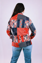 women's vintage 1970's long sleeve button up blouse in a navy and red patchwork print polyester