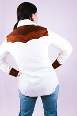 women's 1980's long sleeve popper button up western style blouse in white with brown faux suede panels and has collar
