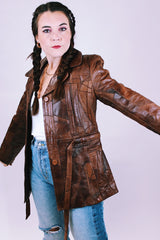 1970's brown leather patchwork jacket buttons up the front with collar and tie waist