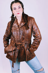 1970's brown leather patchwork jacket buttons up the front with collar and tie waist