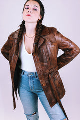 1970's brown leather patchwork jacket buttons up the front with collar and tie waist