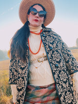 Women's or men's vintage 1970's Towne and King, LTD label long sleeve cream colored cable knit pullover sweater with a fold over turtleneck.