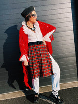 Women's vintage retro 1990's mini length plaid print wrap skirt in red, grey, black, and yellow. Acrylic material. Fringe edge, elastic waistband.