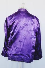 Women's vintage 1950's long sleeve reversible satin open jacket in bright purple and light lavender. Side slits, front pockets and small shoulder pads