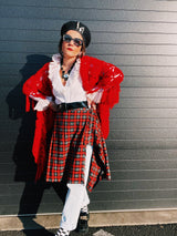 Women's vintage retro 1990's mini length plaid print wrap skirt in red, grey, black, and yellow. Acrylic material. Fringe edge, elastic waistband.