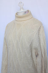 Women's or men's vintage 1970's Towne and King, LTD label long sleeve cream colored cable knit pullover sweater with a fold over turtleneck.