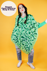 green crochet knit poncho with fringed hem vintage 1970's