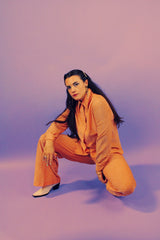 peach metallic set with long sleeve button up collared blouse and elastic waistband pants with slight flair