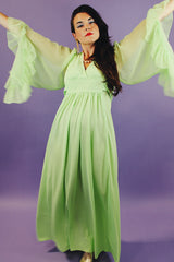 long teal dress with big sheer ruffle bell sleeves and a tie waist vintage 1970's