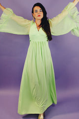 long teal dress with big sheer ruffle bell sleeves and a tie waist vintage 1970's