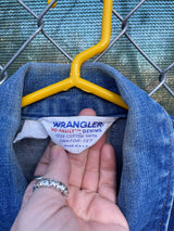 Women's vintage 1970's Wrangler, Made in USA long sleeve button up medium wash denim jacket with brass hardware and pockets. 