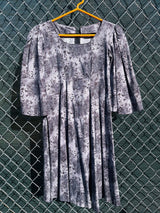 Women's vintage 1970's short length short sleeve grey printed dress with big bell sleeves in a cotton material. 