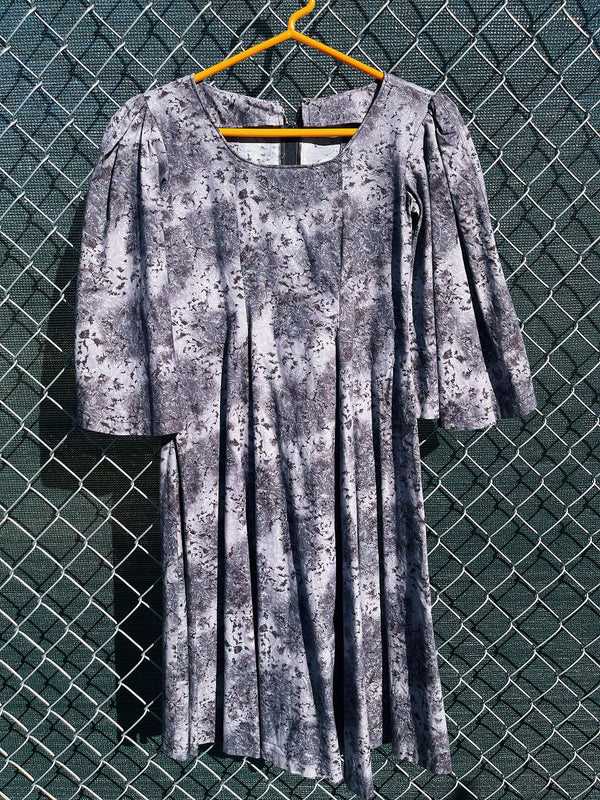 Women's vintage 1970's short length short sleeve grey printed dress with big bell sleeves in a cotton material. 