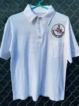 Women's or men's vintage 1970's short sleeve white polo t-shirt with half button closure and a graphic on the front left chest and one in the back. 
