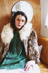 Women's vintage 1970's Dino Ricco, Made in Hong Kong label Penny Lane long sleeve genuine fur coat with a brown body and big cream fur trim on neck.