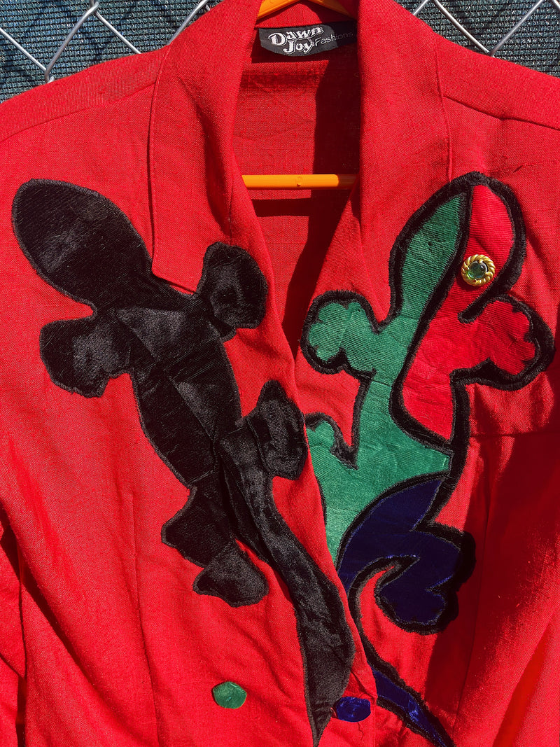 Women's vintage 1980's Dawn Joy Fashions label long sleeve double breasted red blazer with velvet lizards on it. 