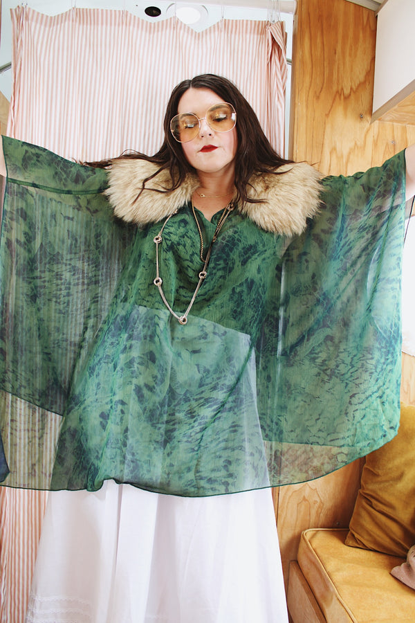 Women's vintage 1990's green and navy sheer polyester material cape top. Has no armholes, just a hole for your head. Tie dye print. 