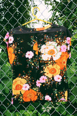 Women's vintage 1970's short capped sleeve top in black with pink and orange floral print all over. Sheer and lightweight.