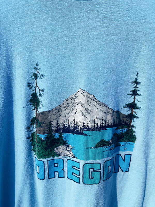 Women's or men's vintage 1986's Lexington label short sleeve baby blue graphic t-shirt with Oregon mountain graphic on the front. 