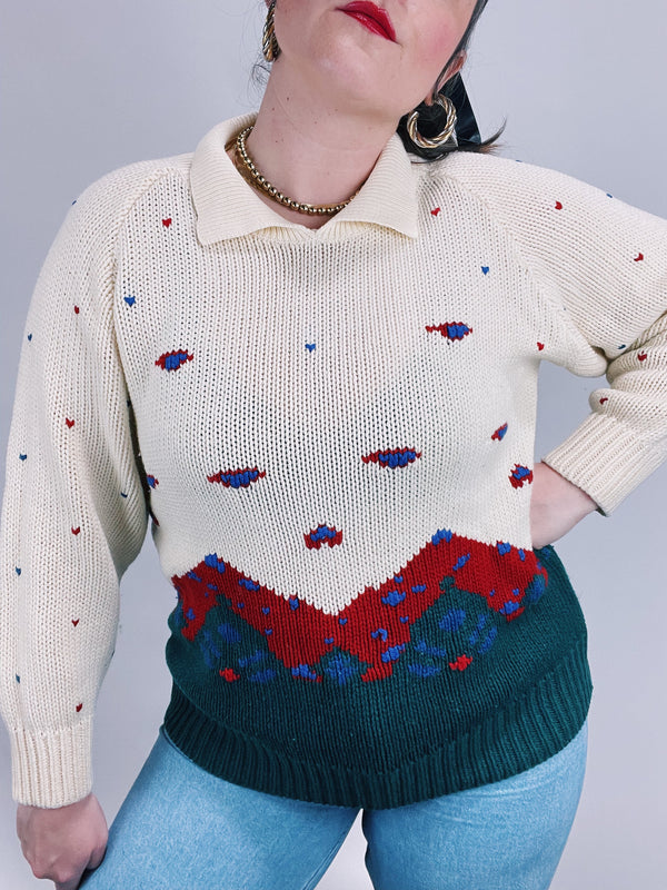 long sleeve cream pullover sweater with collar and mountain print
