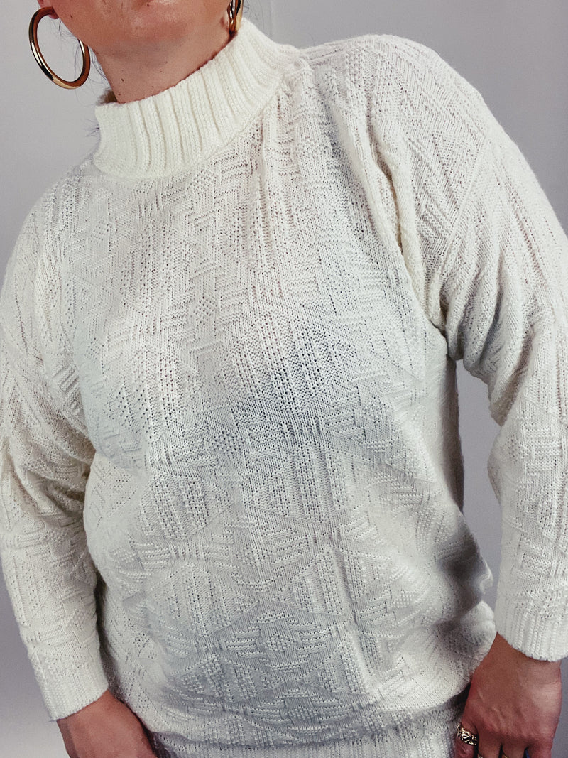 Women's 1980's Spunky, Made in USA label long sleeve white pullover sweater with a mock neck in acrylic textured material. 