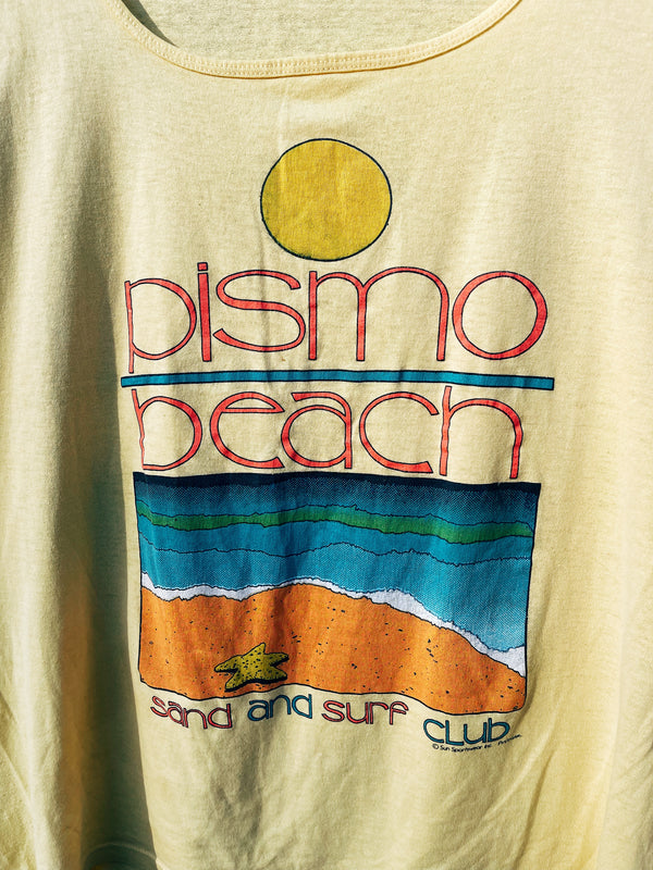 Women's or men's vintage 1980's Surf Gear label XL sleeveless yellow tank top t-shirt with Pismo Beach multicolored graphic on the front. 