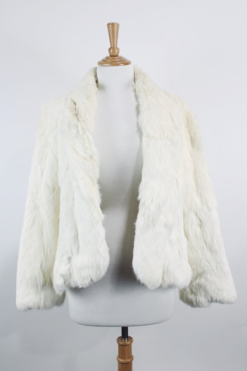 Women's vintage 1970's Wilsons Suede & Leather, Made in Korea label long sleeve bright white genuine fur coat with one hook and eye closure in the front. 