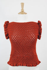 Women's vintage burnt orange acrylic crochet sweater top. Sleeveless with ruffles trim on shoulders. Has a short fit.