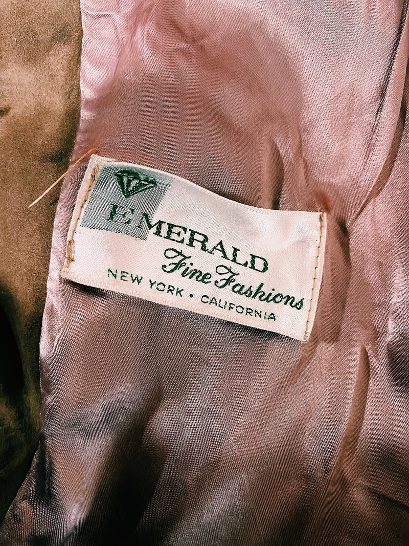 Women's vintage 1960's Emerald Fine Fashions label 3/4 arm length long tan suede mod style jacket with genuine fur trim around neck.