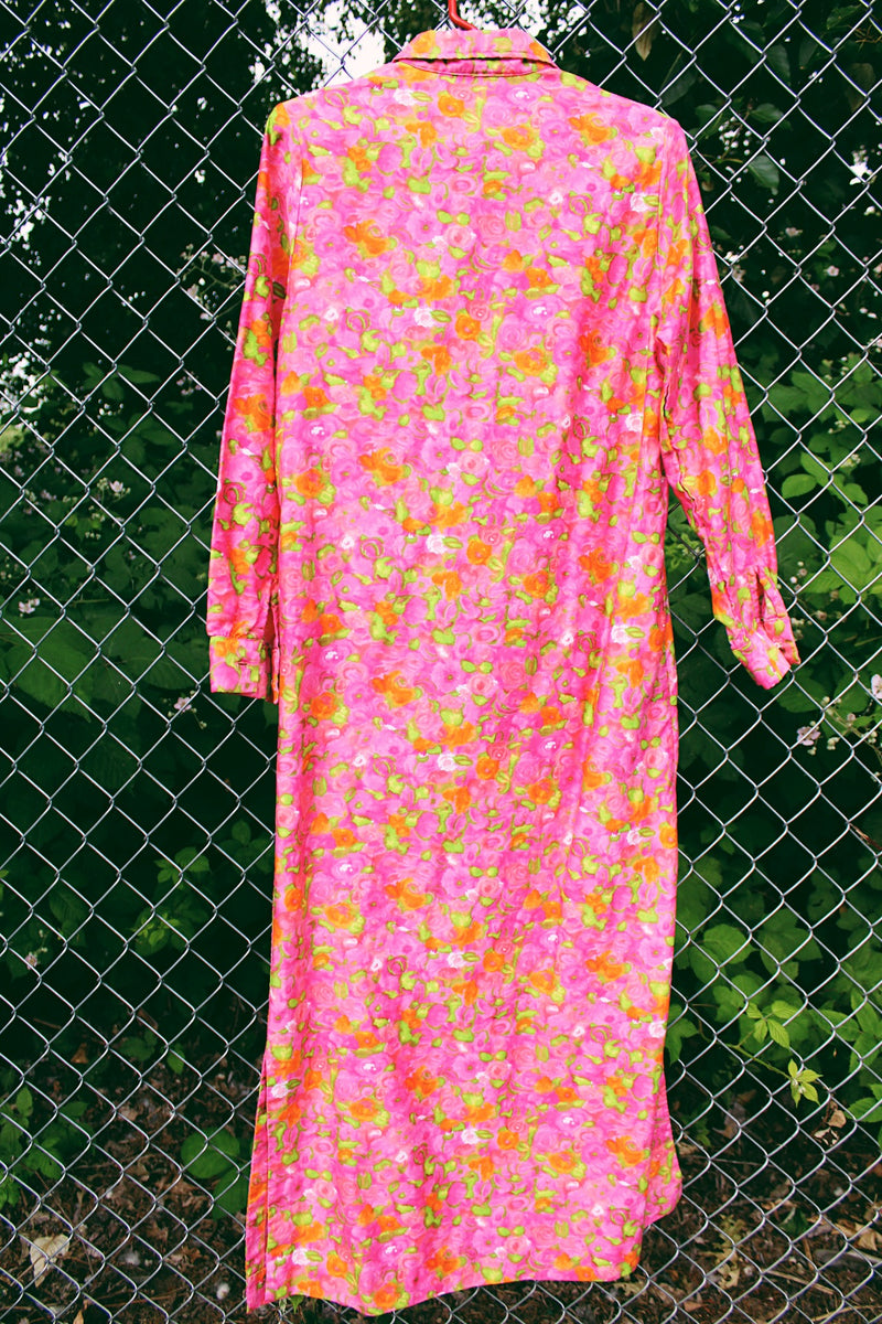 Women's vintage 1970's Bellariva label long sleeve ankle length button up shirt dress with collar. All over pink and orange floral print. 