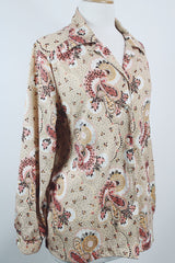 Women's vintage 1970's Stephanie, K by Koret label long sleeve button up blouse with small dagger collar in tan color and all over pale pink paisley print.