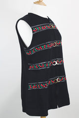 Women's vintage 1970's Palena Knitwear, Made in Hong Kong label sleeveless black wool vest with brass buckles closures up the front and floral trim details.