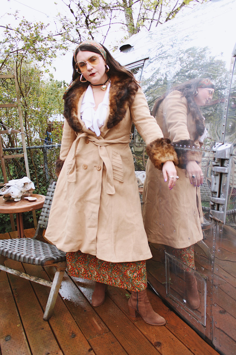 Women's vintage 1970's Domino, New York label long sleeve knee length light tan camel colored wool coat with brown genuine fur trim around collar and cuffs.