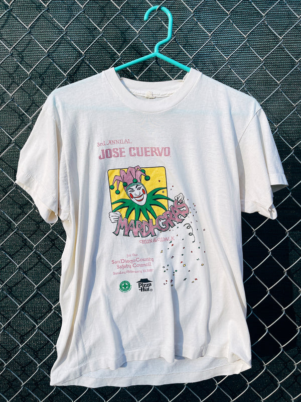 Women's or men's vintage 1980's Screen Stars label short sleeve off white cream graphic t-shirt with yellow, purple, and green joker graphic on the front. 