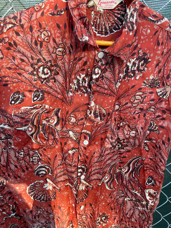 Men's vintage 1950's/1960's Leonardo label short sleeve button up rayon shirt in brown color with all over fish and seashell print. 