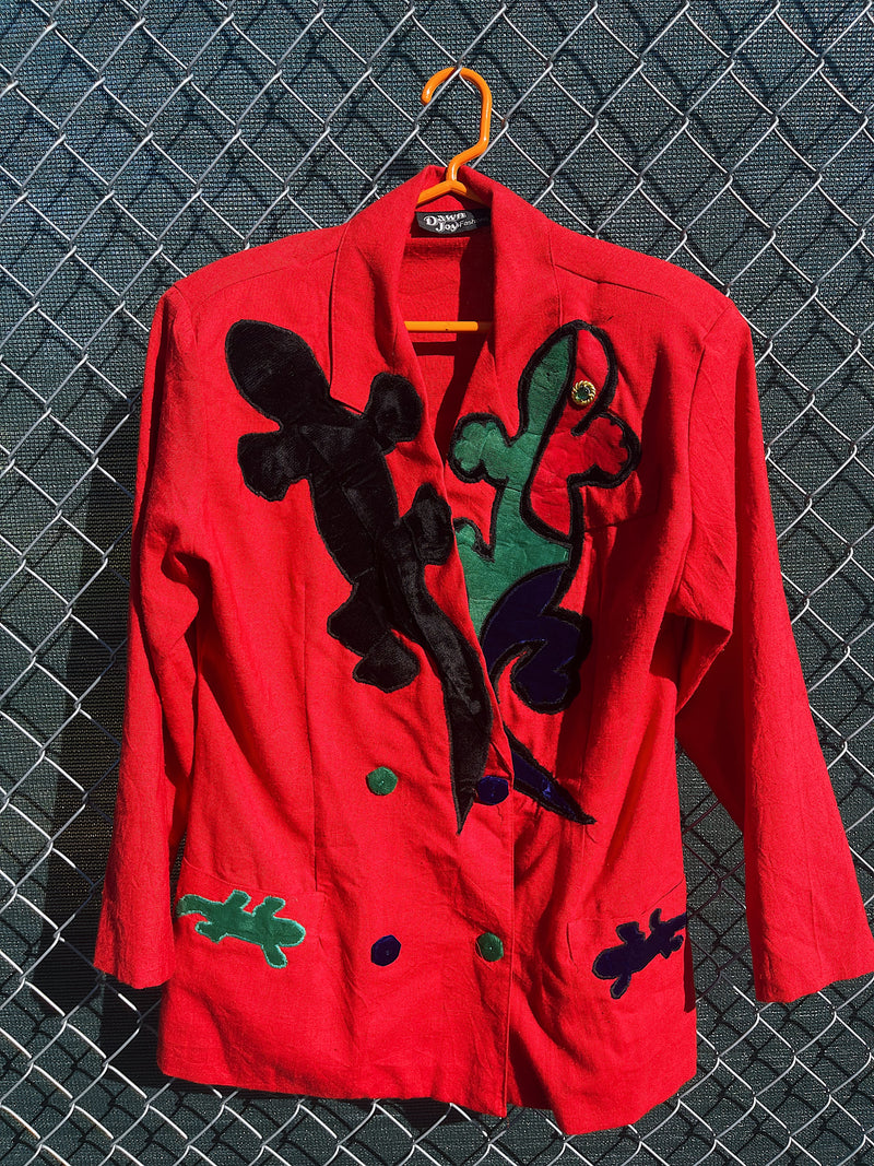 Women's vintage 1980's Dawn Joy Fashions label long sleeve double breasted red blazer with velvet lizards on it. 