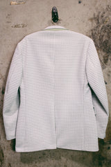 Women's or men's vintage 1970's JCPenny label long sleeve blazer in polyester material. Has a all over light green and white houndstooth print.