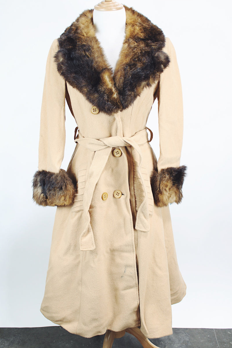 Women's vintage 1970's Domino, New York label long sleeve knee length light tan camel colored wool coat with brown genuine fur trim around collar and cuffs.