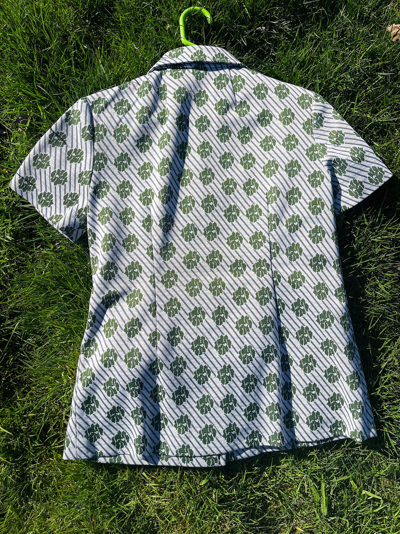 Women's vintage 1970's short sleeve button up shirt blouse in green and white print in polyester material. 