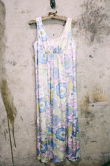 Women's vintage 1970's sleeveless ankle length maxi dress. Nightgown loungewear style with an all over pink, green, and blue pastel colored print.