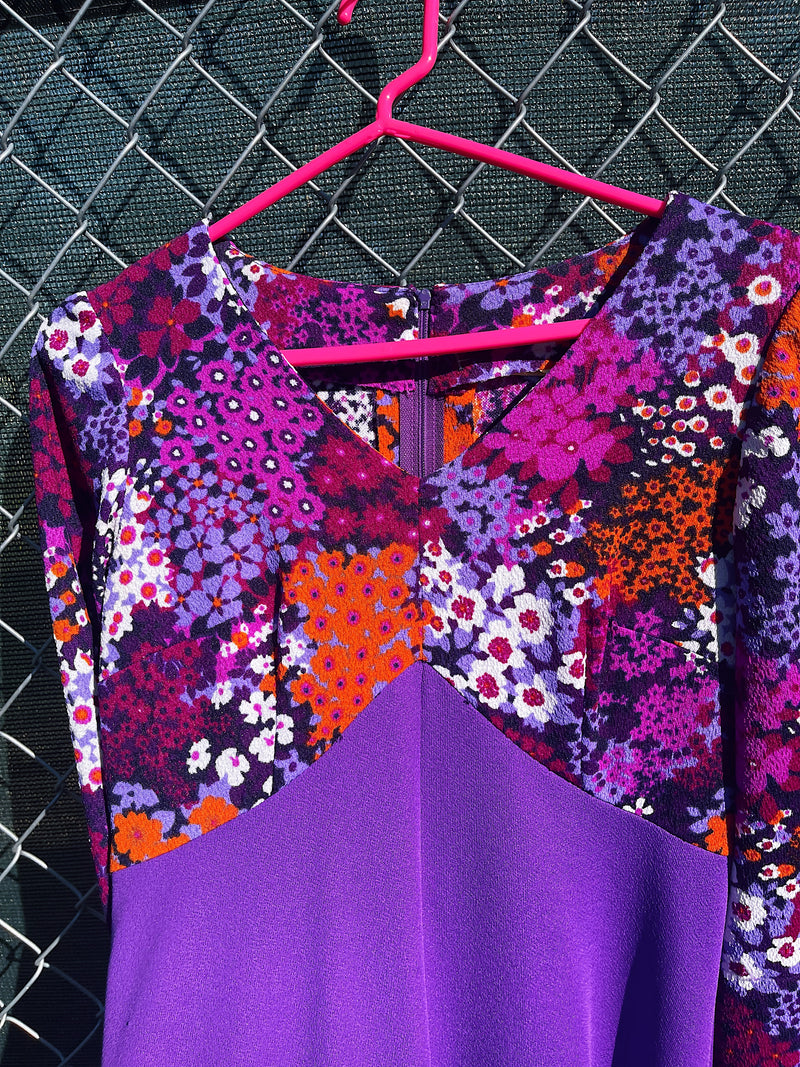 Women's vintage 1970's long sleeve maxi length dress in purple and multicolored floral print in polyester material. 