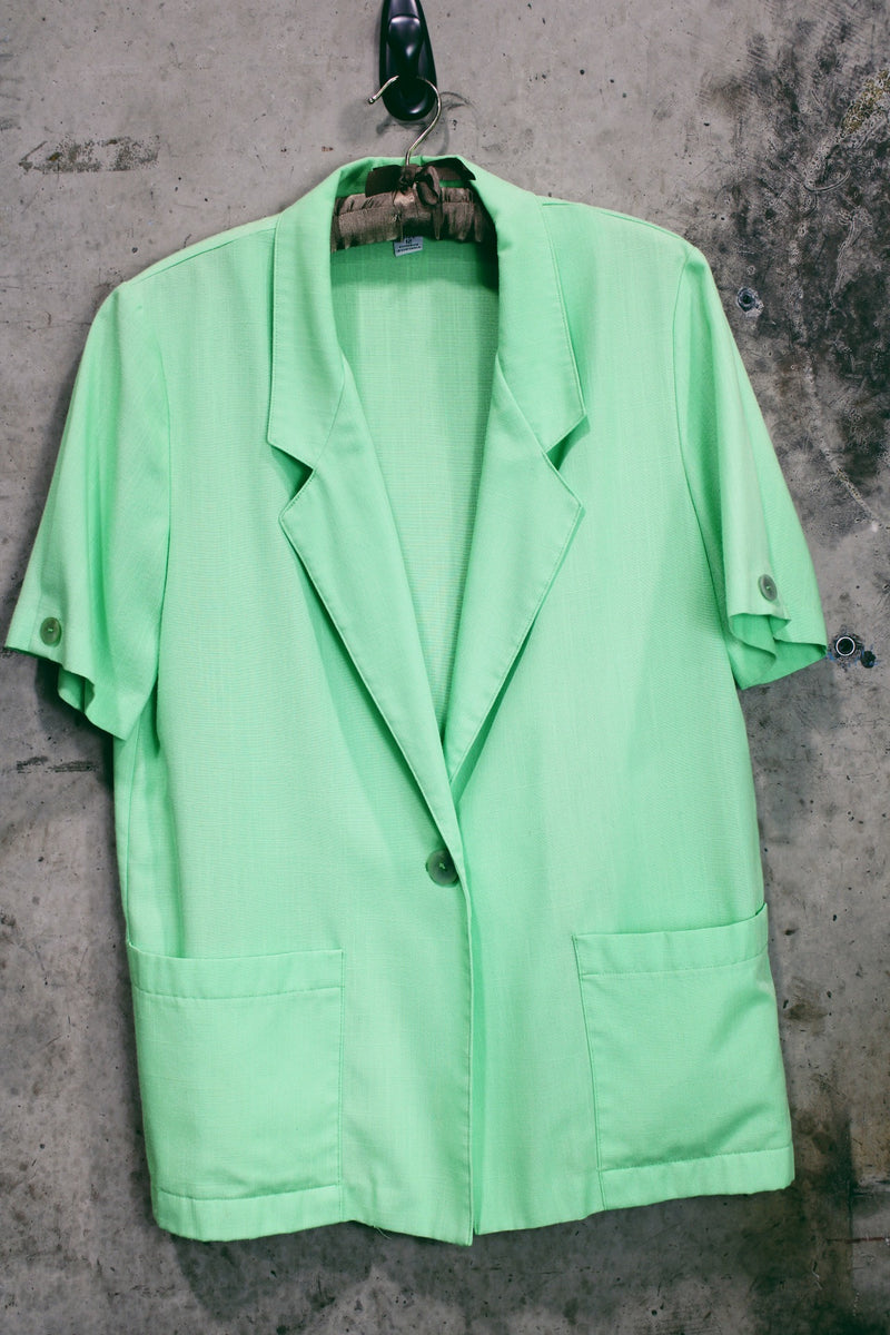 Women's vintage 1980's Sag Harbor label short sleeve lightweight lime green blazer with a one button closure. Rayon and Polyester material, perfect for Summer.