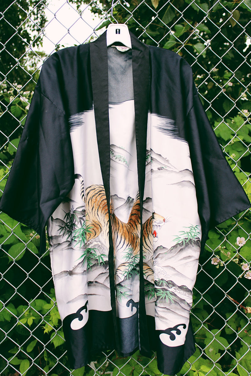 Women's vintage 1970's Ichi Ban, Made in Japan short sleeve black and white satin like material open front kimono robe with a tiger graphic on front and back.