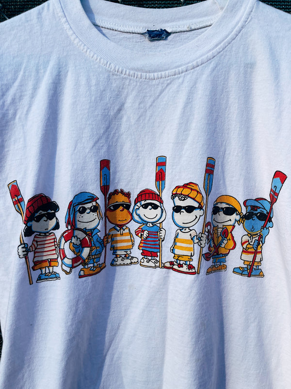 Women's vintage 1990's Crazy Tees short sleeve white graphic t-shirt with a Peanuts multicolored graphic on the front. 