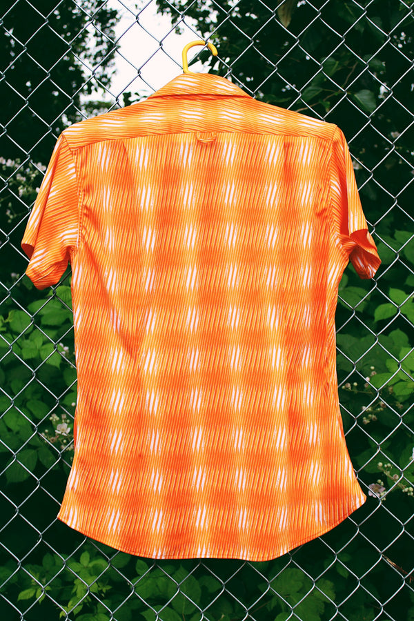 Women's or men's vintage Y2k Mediterranea, Made in Italy label short sleeve button. up shirt with an all over vibrant orange print. 
