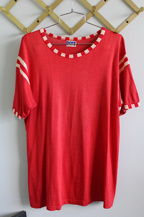 Women's or men's vintage 1970's Post label short sleeve red sports top with white stripes on arms, red and white trim, and white graphic with words on the back. 