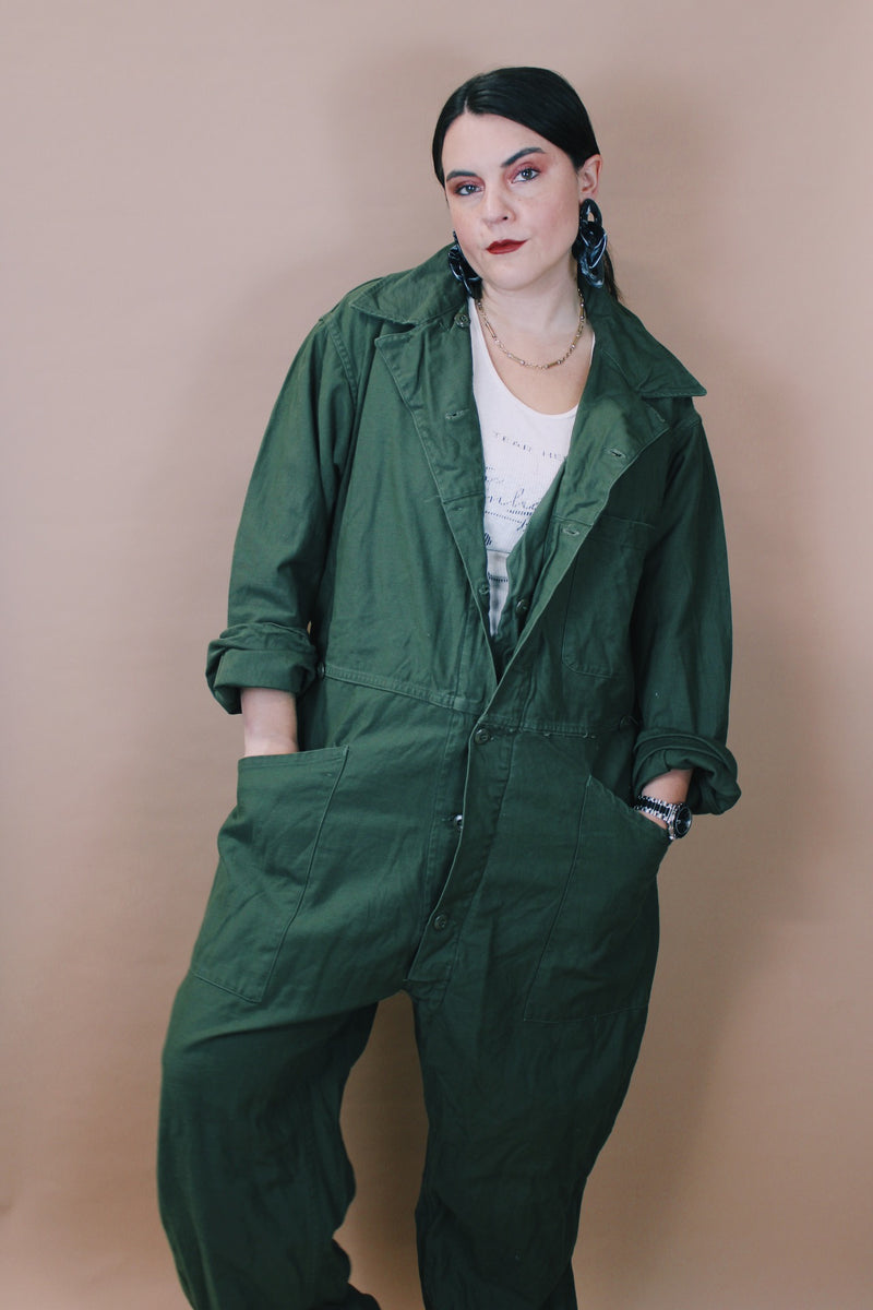 Men's vintage 1980's Men's Coveralls Type 1 label size XL long sleeve army green one piece jumpsuit with button closure and pockets in cotton material.