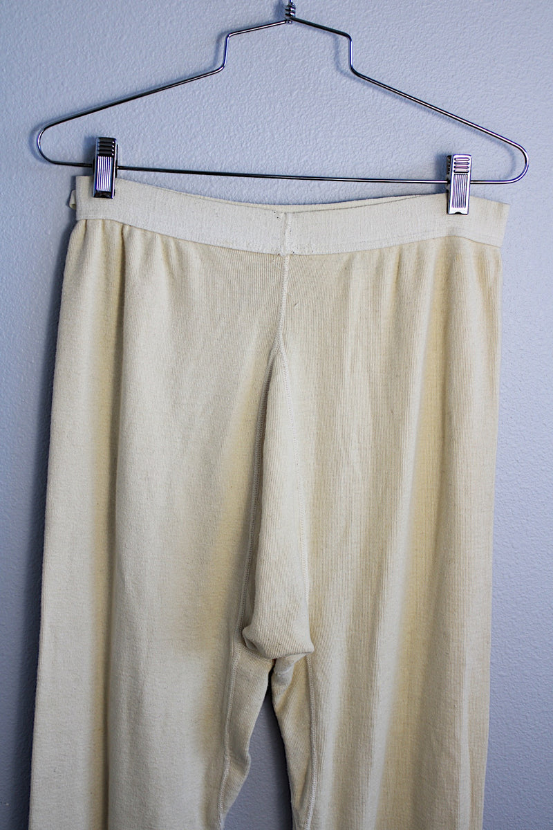 Men's or women's vintage 1950's cream colored wool material military long john underwear. Ribbed ankles and elastic waistband.